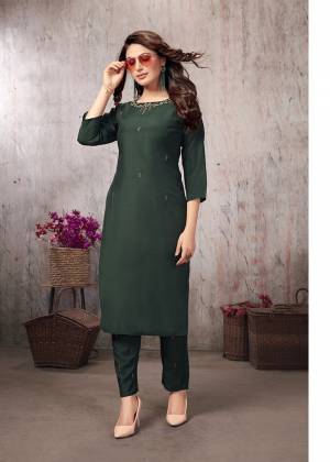 Add This Very Beautiful Designer Readymade Kurti With Pants In Pine Green Color. This Readymade Pair Is Fabricated On Muslin Beautified With Elegant Hand Work. It Is Available In All Sizes And Also Its Fabric Ensures Superb Comfort All Day Long. 