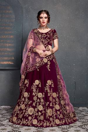 Enhance Your Personality Wearing This Attractive Looking Heavy Designer Lehenga Choli In Magenta Pink Color Paired With Pink Colored Dupatta. This Heavy Embroidered Lehenga Choli Is Fabricated On Velvet Paired With Net Fabricated Embroidered Dupatta. 