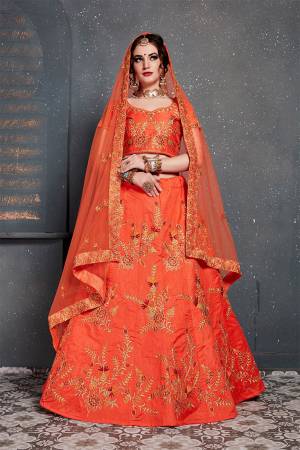 Catch All The Limelight At The Next Wedding You Attend Wearing This Heavy Designer Lehenga Choli In All Over Orange Color. This Lehnega Choli Is Slub Silk Based Paired With Net Fabricated Dupatta.
