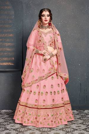 Catch All The Limelight At The Next Wedding You Attend Wearing This Heavy Designer Lehenga Choli In All Over Pink Color. This Lehnega Choli Is Slub Silk Based Paired With Net Fabricated Dupatta.