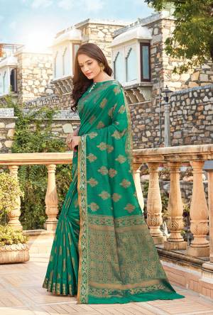 For Your Semi-Casuals, Grab This Saree In Sea Green Color Paired With?Sea Green Colored Blouse. This Saree And Blouse Are Fabricated On Handloom Cotton Which Is Durable, Light Weight And Easy To Carry All Day Long