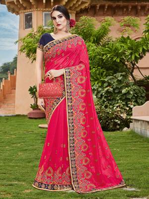 For A Royal Look, Grab This Heavy Designer Saree In Dark Pink Color Paired With Navy Blue Colored Blouse. This Saree And Blouse Are Silk Based Beautified With Heavy Embroidery. This Lovely Saree Is Suitable For Wedding And Party Wear. 