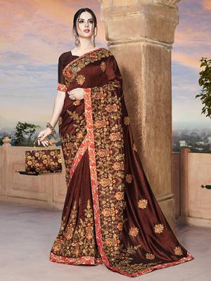 For A Royal Look, Grab This Heavy Designer Saree In Brown Color Paired With Brown Colored Blouse. This Saree And Blouse Are Silk Based Beautified With Heavy Embroidery. This Lovely Saree Is Suitable For Wedding And Party Wear. 