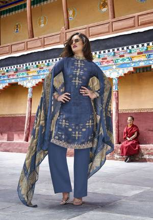 Celebrate This Festive Season With Beauty And Comfort In This Very Pretty Suit In Blue Color. Its Pretty Embroidered And Printed Top Is Silk Based Paired With Cotton Satin Bottom And Chiffon Fabricated Dupatta. Buy Now.