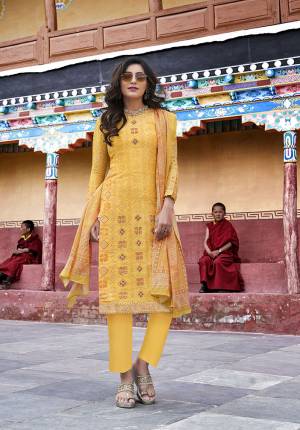 Celebrate This Festive Season With Beauty And Comfort In This Very Pretty Suit In Yellow Color. Its Pretty Embroidered And Printed Top Is Silk Based Paired With Cotton Satin Bottom And Chiffon Fabricated Dupatta. Buy Now.