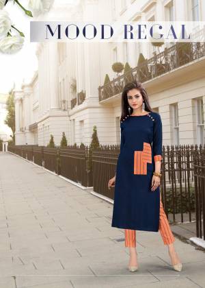 For Your Semi-Casual Wear, Grab This Readymade Kurti In Navy Blue Color Paired With Contrasting Orange Colored Bottom. The Kurti Is Fabricated On Rayon Paired With Cotton Based Pants. Buy This Pair Now.