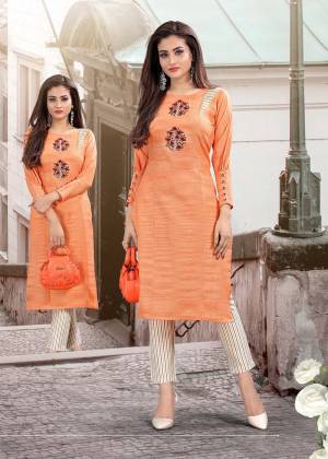 Add This Pretty Readymade Kurti To Your Wardrobe In Orange Color Paired With Off-White Colored Readymade Bottom. This Pair Is Cotton Based Beautified With Thread Embroidery. 