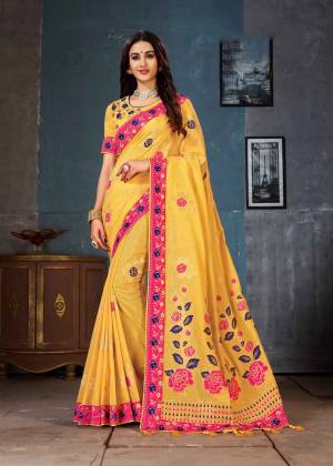 Add This Beautiful Designer Saree To Your Wardrobe In Yellow Color. This Saree And Blouse Are Fabricated On Linen Cotton Silk Beautified With Weaving And Attractive Embroidery. 