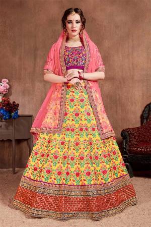 Go Colorful With This Attractive Designer Lehenga Choli In Magenta Pink Colored Blouse Paired With Yellow Colored Lehenga And Pink Colored Dupatta. This Lehenga Choli Is Silk Based Paired With Net Fabricated Dupatta. It Is Beautified With Heavy Detailed Embroidery Giving An Attractive Look. 