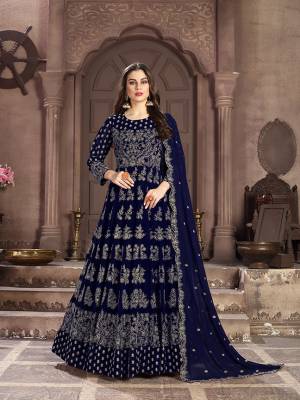 Add This Lovely Designer Floor Length Suit to Your Wardrobe In Navy Blue Color. Its Beautiful Attractive Embroidered Top and Dupatta are Fabricated On Georgette Paired With Santoon Bottom. This Suir Is Light In Weight And Easy To Carry Throughout The Gala.