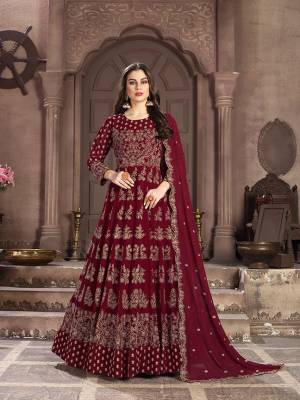 Add This Lovely Designer Floor Length Suit to Your Wardrobe In Maroon Color. Its Beautiful Attractive Embroidered Top and Dupatta are Fabricated On Georgette Paired With Santoon Bottom. This Suir Is Light In Weight And Easy To Carry Throughout The Gala.