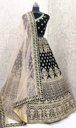 Here Is A Beautiful Designer Bridal Lehenga Choli In Dark Green Color Paired With Light Pastel Pink Colored Dupatta. This Beautiful Heavy Lehenga Choli Is Fabricated On Velvet Paired With Net Fabricated Dupatta. It Is Beautified With Heavy Detailed Embroidery. Get Ready For Your D-Day With This Designer Piece And Look The Most Graceful Of All.
