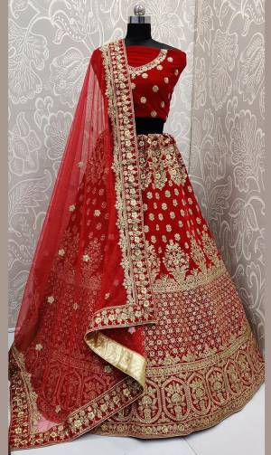 Here Is A Beautiful Designer Bridal Lehenga Choli In Red Color Paired With Red Colored Dupatta. This Beautiful Heavy Lehenga Choli Is Fabricated On Velvet Paired With Net Fabricated Dupatta. It Is Beautified With Heavy Detailed Embroidery. Get Ready For Your D-Day With This Designer Piece And Look The Most Graceful Of All.