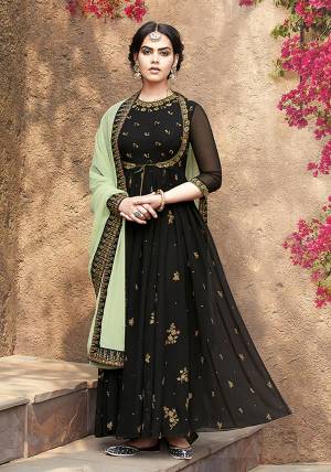 Grab This Very Beautiful Designer Suit In Black Color Paired With Light Green Colored Dupatta. This Pretty Unique Koti Patterned Suit Is Fabricated On Georgette Paired With Santoon Bottom And Net Chiffon fabricated Dupatta. It Is Light In Weight And Easy To Carry All Day Long. 