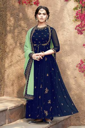 Grab This Very Beautiful Designer Suit In Royal Blue Color Paired With Light Green Colored Dupatta. This Pretty Unique Koti Patterned Suit Is Fabricated On Georgette Paired With Santoon Bottom And Net Chiffon fabricated Dupatta. It Is Light In Weight And Easy To Carry All Day Long. 
