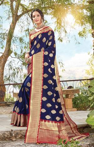 Classy Saree look pretty like never before.Wearing this Navy Blue Color Saree which made from Dola Art Silk With Maroon Color Dola Silk blouse, Saree has also decorative work like Heavy Zari Work.This beautiful Saree features a classy Zari Work Work all over,which makes it a smart pick for all occasions. You can wear this Saree in different styles Pairing It Will Different Accessories. 