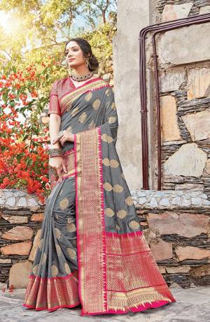 Classy Saree look pretty like never before.Wearing this Grey Color Saree which made from Dola Art Silk With Rani Pink Color Dola Silk blouse, Saree has also decorative work like Heavy Zari Work.This beautiful Saree features a classy Zari Work Work all over,which makes it a smart pick for all occasions. You can wear this Saree in different styles Pairing It Will Different Accessories. 