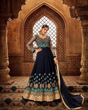 Enhance Your Personality Wearing This Designer Floor Length Suit In Navy Blue Color. Its Heavy Embroidered Top Is Georgette Based With An Attractive Embroidered Yoke Paired With Santoon Bottom And Chiffon Fabricated Dupatta. Buy This Pretty Suit Now.