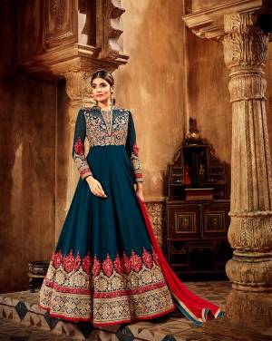 Grab This Very Beautiful Designer Floor Length Suit In New Shade Of Blue In Prussian Blue Color Paired With Contrasting Red Colored Blouse. Its Top Is Fabricated On Georgette Paired With Santoon Bottom And Chiffon Fabricated Dupatta.  