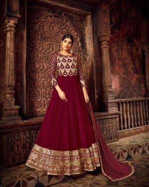 You Will Definitely Earn Lots Of Compliments Wearing This Heavy Designer Floor Length Suit In Maroon Color. Its Heavy Embroidered Top Is Georgette Based Paired With Santoon Bottom And Chiffon Fabricated Dupatta. Buy Now.
