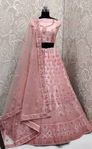 Look The Most Elegant Of All This Wedding Season Wearing This Heavy Designer Lehenga Choli In Pink Color. This Beautiful Heavy Tone To Tone Embroidered Lehenga Choli Is Fabricated On Net. Its Rich Color and Detailed Embroidery Will earn You Lots Of Compliments From Onlookers