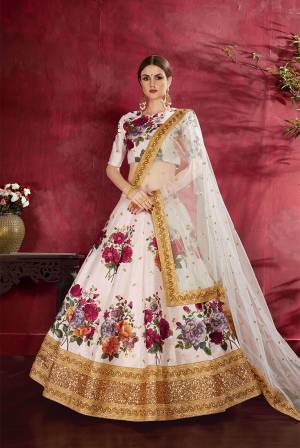 Adorn A Lovely Trendy Look This Wedding Season With This Heavy Designer Lehenga Choli In Off-White Color. This Beautiful Lehenga Choli Is Art Silk Beautified With Attractive Digital Print And Embroidery Paired With Net Fabricated Embroidered Dupatta. Buy This Lovely Lehenga Choli Now.