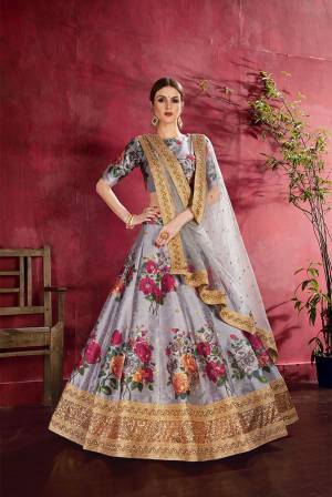 Adorn A Lovely Trendy Look This Wedding Season With This Heavy Designer Lehenga Choli In Grey Color. This Beautiful Lehenga Choli Is Art Silk Beautified With Attractive Digital Print And Embroidery Paired With Net Fabricated Embroidered Dupatta. Buy This Lovely Lehenga Choli Now.