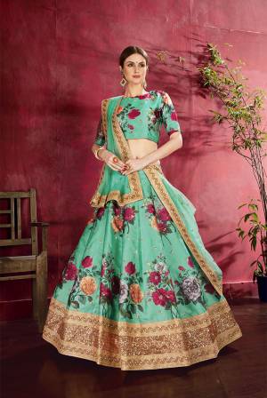 Adorn A Lovely Trendy Look This Wedding Season With This Heavy Designer Lehenga Choli In Sea Green Color. This Beautiful Lehenga Choli Is Art Silk Beautified With Attractive Digital Print And Embroidery Paired With Net Fabricated Embroidered Dupatta. Buy This Lovely Lehenga Choli Now.