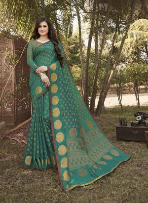 Celebrate This Festive Season With Beauty And Comfort Wearing This Pretty Sea Green Colored Saree. This Saree Is Fabricated On Handloom Silk Paired With Jacquard Silk Fabricated Blouse. It Is Light Weight, Easy To Drape and Carry All Day Long. 