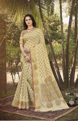 Here Is A Rich Looking Designer Silk Based Saree In Cream Color. This Saree Is Fabricated On Handloom Silk Paired With Jacquard Silk Fabricated Blouse. Buy Now.