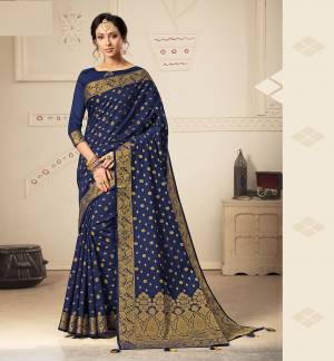 Here Is A Beautiful Designer Silk Based Saree In Royal Blue Color. This Pretty Weaved Saree Is Fabricated On Banarasi Art Silk Paired With Art Silk Fabricated Blouse. Buy This Saree Now.