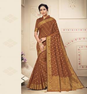 Celebrate This Festive Season In A Lovely Traditional Look With This Designer Saree In Brown Color. This Saree Is Fabricated on Banarasi Art Silk Beautified With Heavy Weave Paired with Art Silk Fabricated Blouse. Buy This Rich Looking Saree Now.