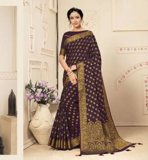 Here Is A Beautiful Designer Silk Based Saree In Dark Purple Color. This Pretty Weaved Saree Is Fabricated On Banarasi Art Silk Paired With Art Silk Fabricated Blouse. Buy This Saree Now.