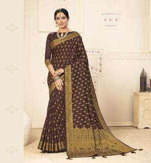 Flaunt Your Rich And Elegant Taste Wearing This Lovely Silk Based Saree In Dark Brown Color. This Saree Is Fabricated On Banarasi Art Silk Paired With Art Silk Fabricated Blouse, It Is Beautified With Pretty Weave. Buy Now