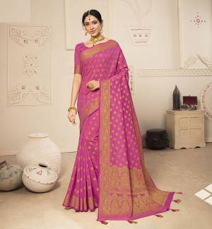 Celebrate This Festive Season In A Lovely Traditional Look With This Designer Saree In Pink Color. This Saree Is Fabricated on Banarasi Art Silk Beautified With Heavy Weave Paired with Art Silk Fabricated Blouse. Buy This Rich Looking Saree Now.
