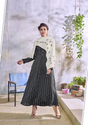 Here Is Pretty Designer Kurti For Your Semi-Casual Or Festive Wear In Black Color Paired With Off-White Colored Designer Embroidered Scarf. This Kurti Is Handloom Cotton Based Paired With Rayon Scarf. 