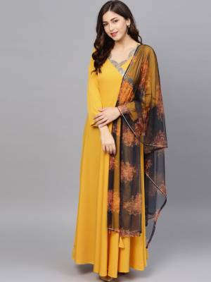 Grab This Beautiful Pair Of Readymade Gown In Yellow Color Paired With Black Colored Digital Printed Dupatta. This Pretty Gown Is Crepe Based Paired With Net Fabricated Dupatta. It Is Available In All Regular Sizes And its Fabric Ensures Superb Comfort all Day Long. 