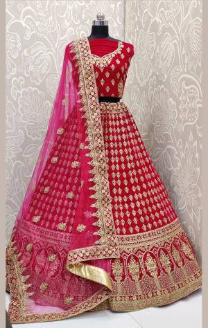 Here Is A Beautiful Designer Bridal Lehenga Choli In Rani Pink Color Paired With Rani Pink Colored Dupatta. This Beautiful Heavy Lehenga Choli Is Fabricated On Velvet Paired With Net Fabricated Dupatta. It Is Beautified With Heavy Detailed Embroidery. Get Ready For Your D-Day With This Designer Piece And Look The Most Graceful Of All