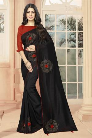 Add Some Semi-Casuals With This Pretty Designer Saree In Black Color Paired With Red Colored Blouse. This Saree And Blouse are Fabricated On Art Silk Beautified With Stone Work And 3D Flowers. This Saree Is Light Weight And Easy To Carry All Day Long .