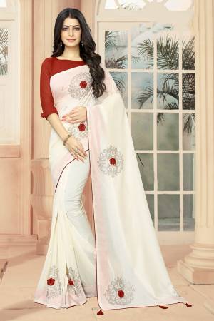 Celebrate This Festive Season With Beauty And Comfort Wearing This Lovely And Elegant Looking Deisgner Saree In White Color Paired With Red Colored Blouse. This Saree And Blouse are Silk Based Beautified With 3D Flowers And Stone Work. 