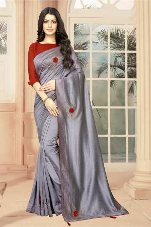 Celebrate This Festive Season With Beauty And Comfort Wearing This Lovely And Elegant Looking Deisgner Saree In Grey Color Paired With Red Colored Blouse. This Saree And Blouse are Silk Based Beautified With 3D Flowers And Stone Work. 