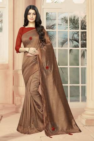 Add Some Semi-Casuals With This Pretty Designer Saree In Brown Color Paired With Red Colored Blouse. This Saree And Blouse are Fabricated On Art Silk Beautified With Stone Work And 3D Flowers. This Saree Is Light Weight And Easy To Carry All Day Long .