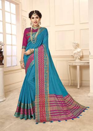 Flaunt Your Rich And Elegant Taste Wearing This Rich Looking Saree In Blue Color Paired With contrasting Magenta Pink Colored Blouse. This Saree Is Fabricated On Cotton Silk Paired With Art Silk Fabricated Blouse. Buy Now.
