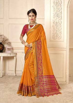 Celebrate This Festive Season With Beauty And Comfort In This Designer Musturd Yellow Colored Saree Paired With Contrasting Rani Pink Colored Blouse. This Saree Is Cotton Silk Based Paired With Art Silk Fabricated Blouse. 