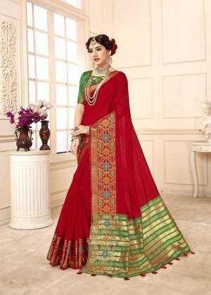 Adorn The Proper Angelic Look Wearing This Lovely Designer Weaved Saree In Red Color Paired With Contrasting Green Colored Blouse. This Saree Is Fabricated On Cotton Silk Paired With Art Silk Fabricated Blouse. Its Rich Fabric Will Give An Enahnced Look To Your Personality. 