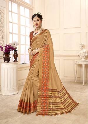 Flaunt Your Rich And Elegant Taste Wearing This Rich Looking Saree In Beige Color Paired With contrasting Brown Colored Blouse. This Saree Is Fabricated On Cotton Silk Paired With Art Silk Fabricated Blouse. Buy Now.