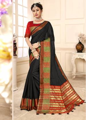 Here Is Proper Traditional Looking Designer Weaved Saree In Black Color Paired With Red Colored Blouse. This Saree Is Fabricated on Cotton Silk Paired With Art Silk Fabricated Blouse. It Is Light Weight And Easy To Carry All Day Long. 