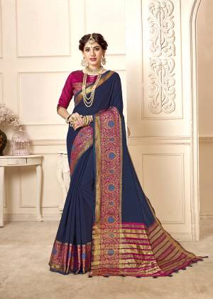 Flaunt Your Rich And Elegant Taste Wearing This Rich Looking Saree In Navy Blue Color Paired With contrasting Magenta Pink Colored Blouse. This Saree Is Fabricated On Cotton Silk Paired With Art Silk Fabricated Blouse. Buy Now.