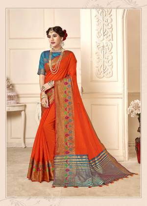 Adorn The Proper Angelic Look Wearing This Lovely Designer Weaved Saree In Orange Color Paired With Contrasting Blue Colored Blouse. This Saree Is Fabricated On Cotton Silk Paired With Art Silk Fabricated Blouse. Its Rich Fabric Will Give An Enahnced Look To Your Personality. 