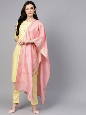 Simple And Elegant Looking Readymade Suit Is Here In Light Yellow Color Paired With Contrasting Pink Colored Dupatta. This Pretty Suit Is Fabricated on Poly Silk Which Is Soft Towards Skin And Gives A Rich look To Your Personality. 